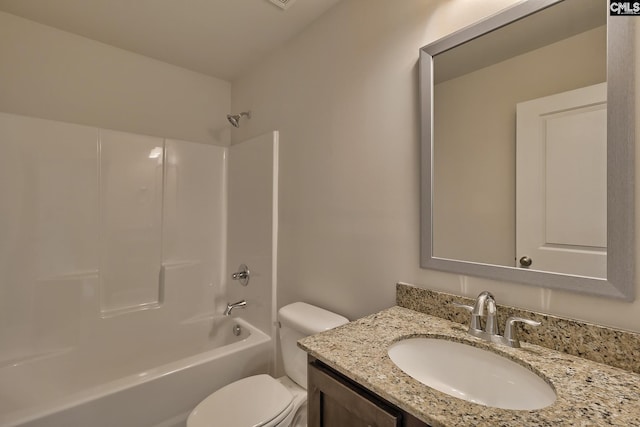 full bathroom featuring vanity, bathtub / shower combination, and toilet