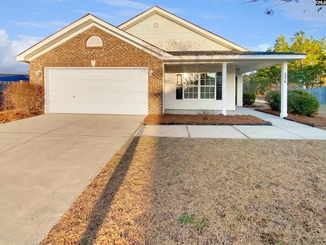 view of front of home with covered porch and a garage