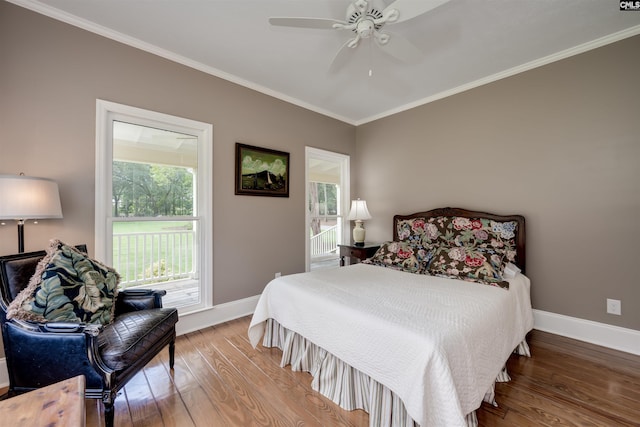 bedroom featuring ceiling fan, wood-type flooring, and ornamental molding