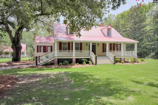 view of front of home featuring covered porch and a front yard