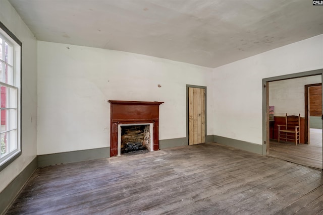 unfurnished living room featuring hardwood / wood-style floors