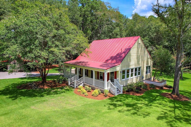 view of front of house with a front yard and a porch