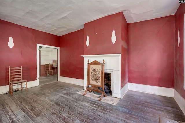 unfurnished living room featuring dark hardwood / wood-style floors