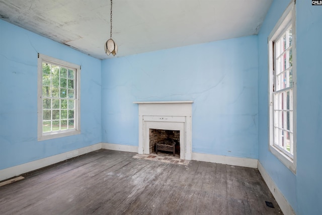 unfurnished living room featuring hardwood / wood-style flooring