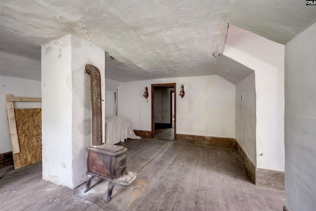 bonus room featuring hardwood / wood-style flooring and vaulted ceiling