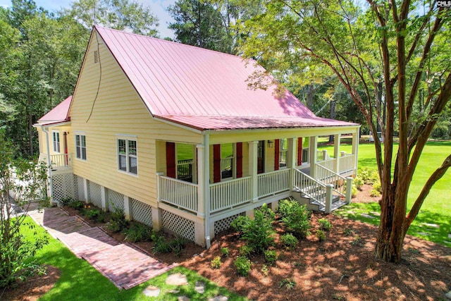 view of property exterior featuring covered porch