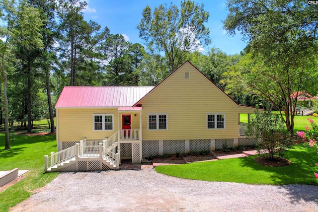 ranch-style home featuring a front yard