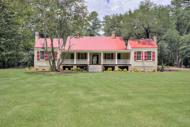 view of front of property with covered porch and a front yard