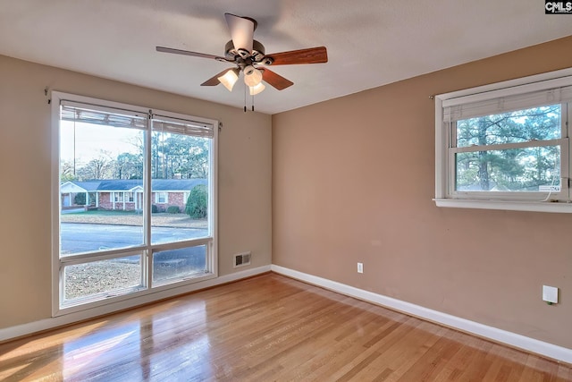 unfurnished room with ceiling fan and light hardwood / wood-style floors