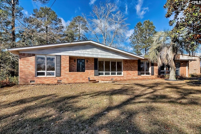 ranch-style home with a front lawn