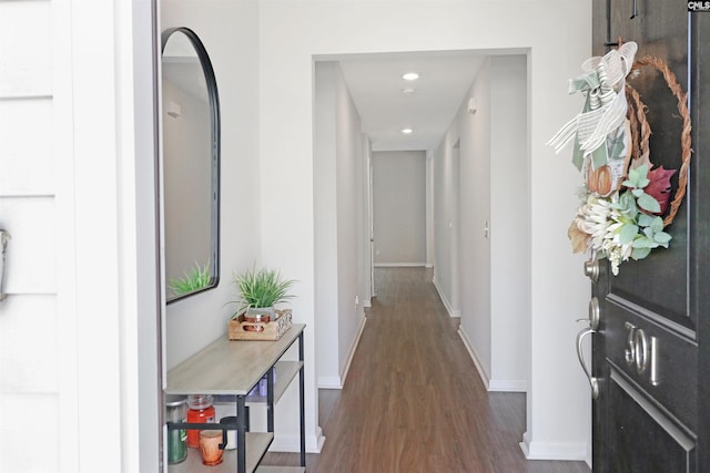 hall with dark wood-type flooring