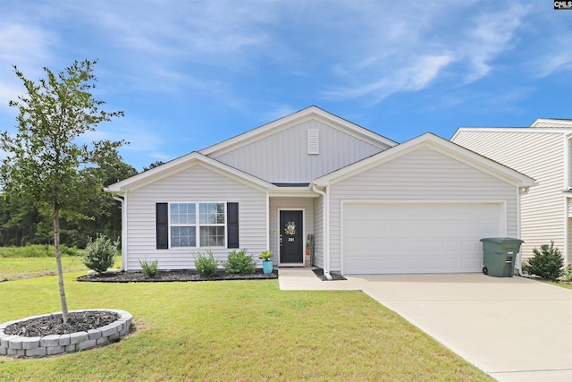 view of front of home featuring a garage and a front yard