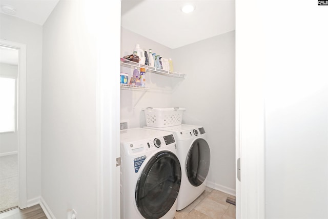 laundry area with independent washer and dryer