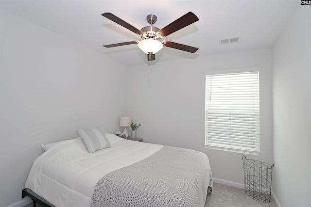 bedroom with light carpet and ceiling fan