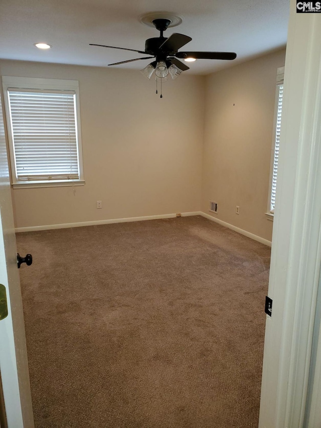 carpeted empty room with ceiling fan