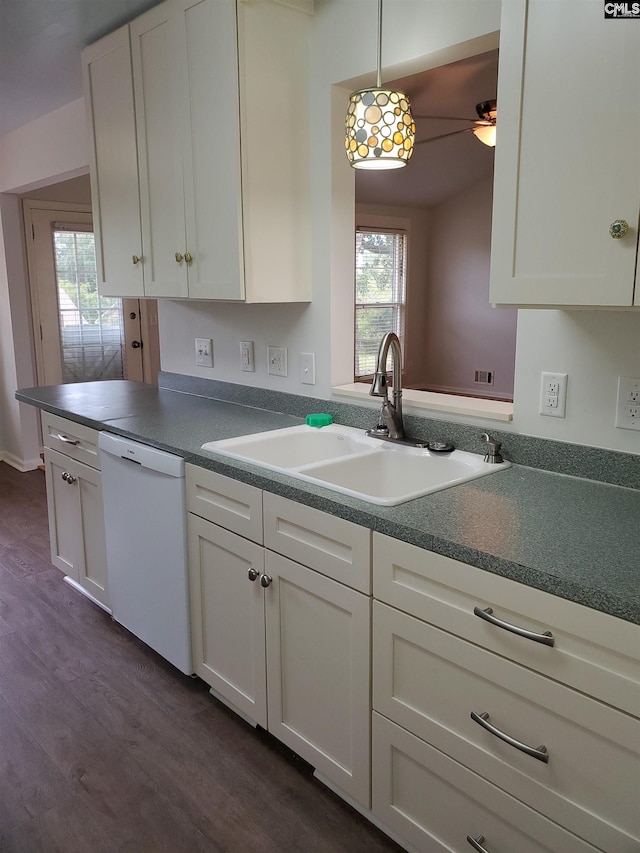 kitchen with white cabinetry, dishwasher, sink, dark wood-type flooring, and hanging light fixtures