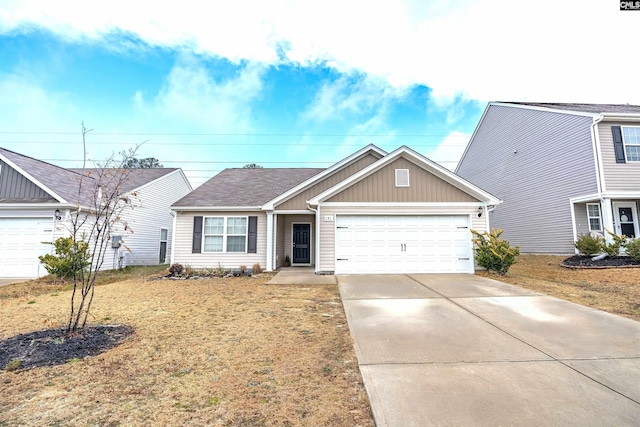 view of front of house with a front lawn and a garage