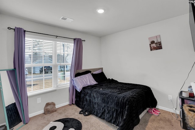 bedroom featuring carpet, visible vents, and baseboards