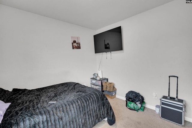 carpeted bedroom with baseboards