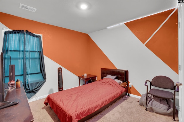 bedroom with lofted ceiling, carpet, visible vents, and baseboards