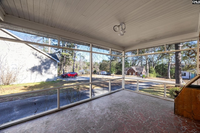 unfurnished sunroom featuring a wealth of natural light