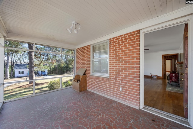 unfurnished sunroom featuring wooden ceiling