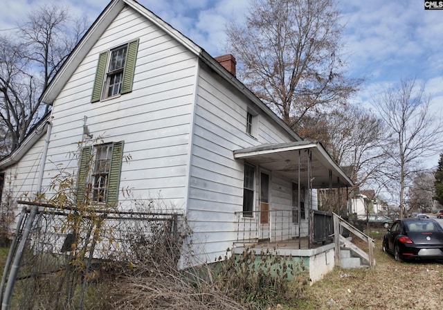 view of home's exterior featuring a porch