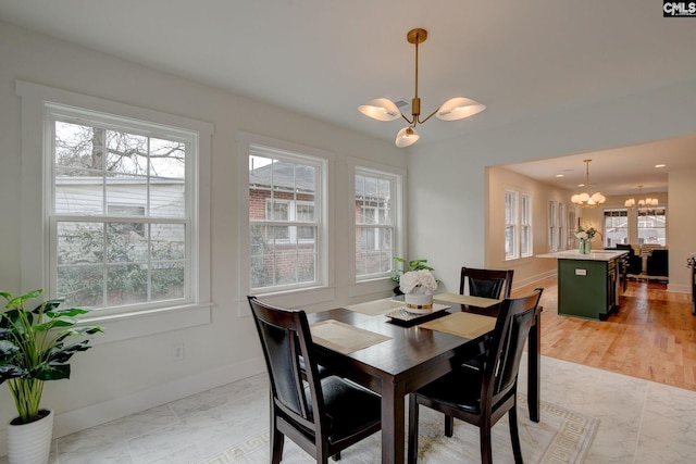 dining area with a notable chandelier