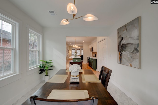 dining room with an inviting chandelier