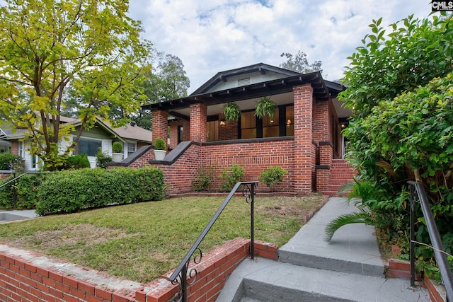 view of front of home with a front yard