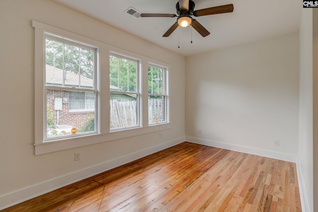 unfurnished room with ceiling fan and light wood-type flooring