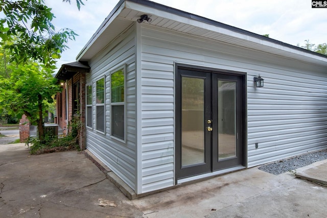 view of home's exterior featuring a patio area and french doors