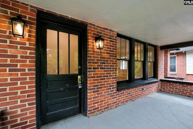 entrance to property with covered porch