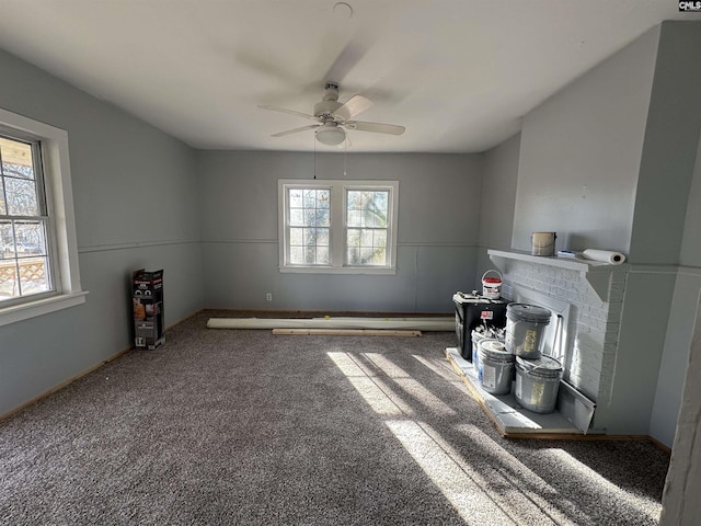 interior space with carpet and ceiling fan