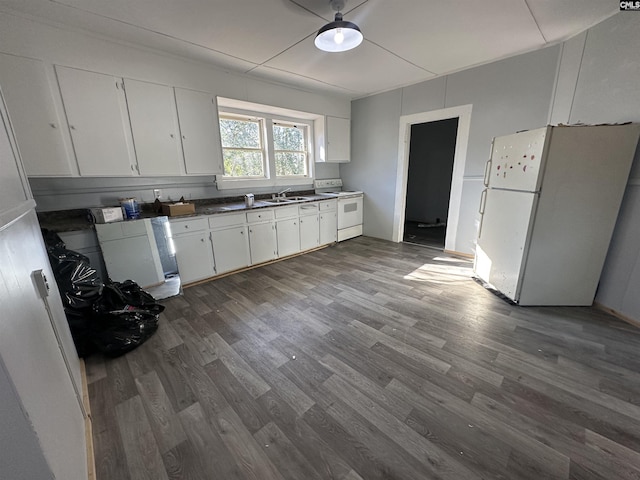 kitchen with white cabinets, white appliances, dark hardwood / wood-style floors, and sink