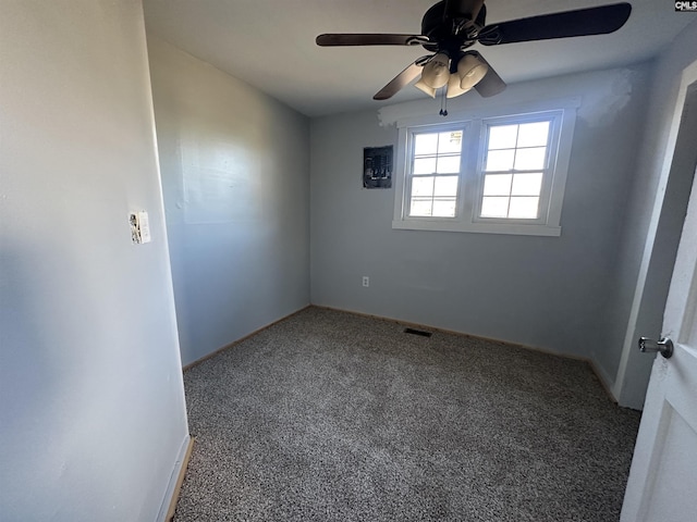 carpeted empty room featuring ceiling fan