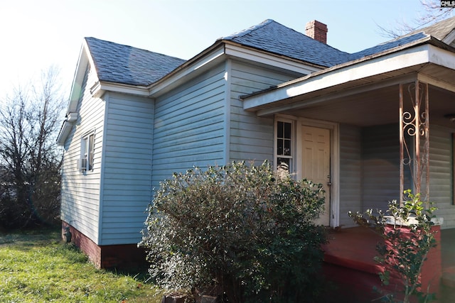 view of side of home featuring a porch