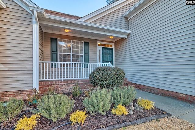 property entrance with covered porch