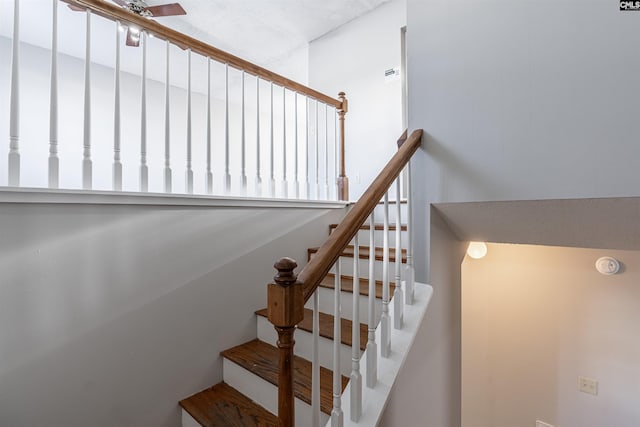 staircase with ceiling fan