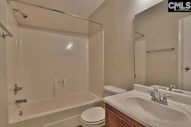 full bathroom with vanity,  shower combination, toilet, and a textured ceiling