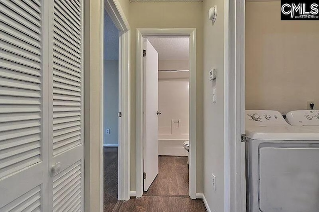 clothes washing area featuring washer and clothes dryer