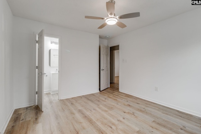 unfurnished bedroom featuring light hardwood / wood-style floors, ceiling fan, and ensuite bathroom