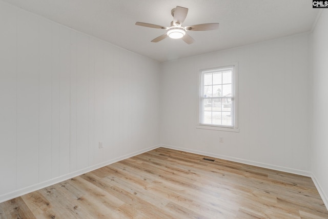 spare room with ceiling fan and light hardwood / wood-style floors