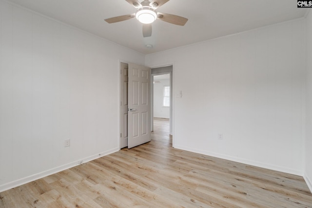 empty room with light wood-type flooring and ceiling fan