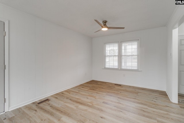 spare room featuring light hardwood / wood-style floors and ceiling fan