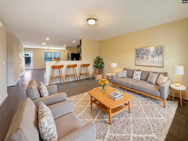 living room with dark hardwood / wood-style floors