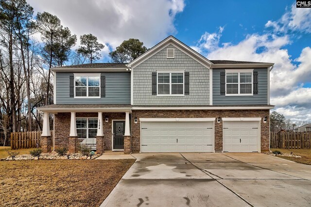 view of front of house with a porch and a garage