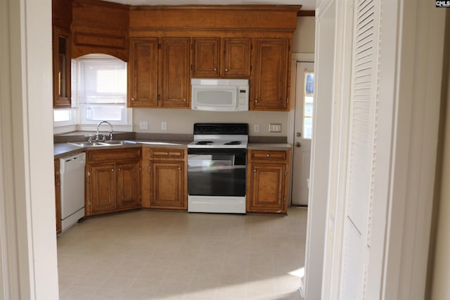 kitchen featuring sink and white appliances