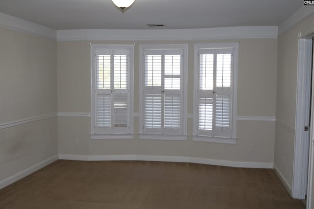 spare room with a healthy amount of sunlight and carpet