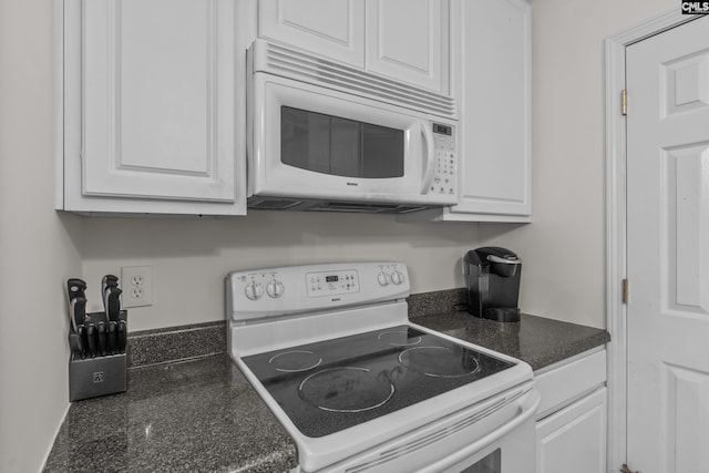 kitchen with white appliances and white cabinetry